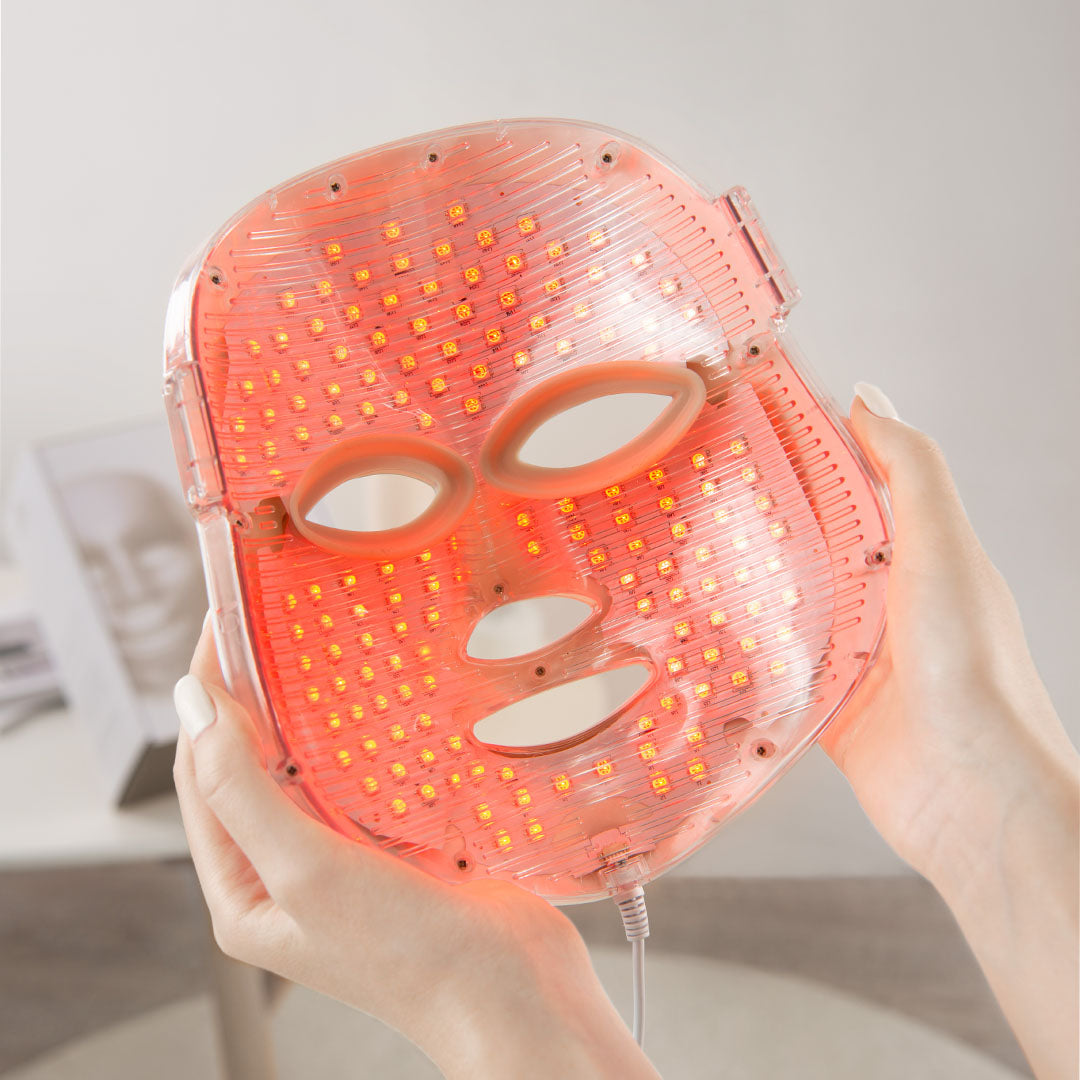 red light therapy mask with 450 LEDs illuminated